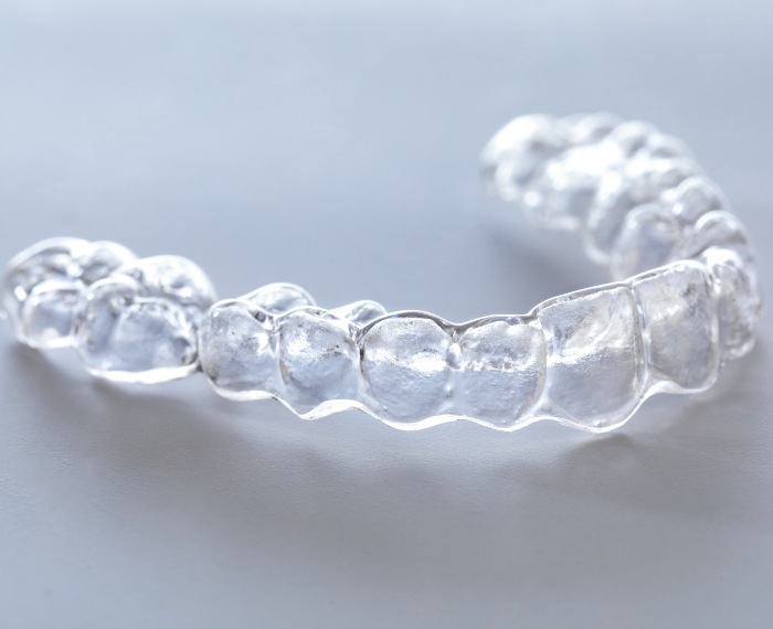 Invisalign clear aligner on tray