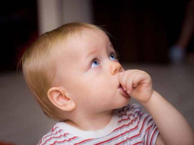 Baby sucking their thumb